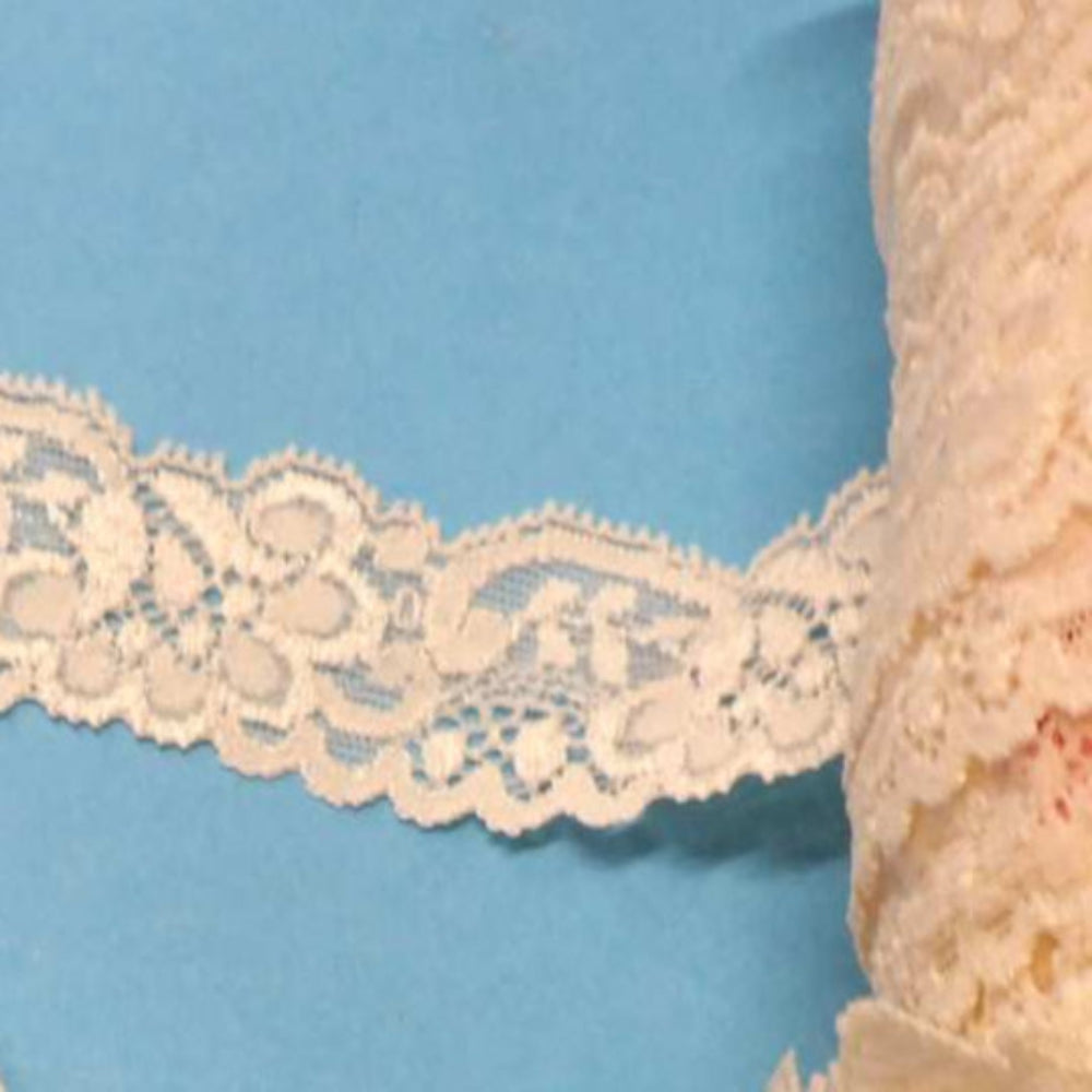 70 metres of Cream Floral stretch lace with 2 wavy lines of rubber on the back 30mm wide clearance