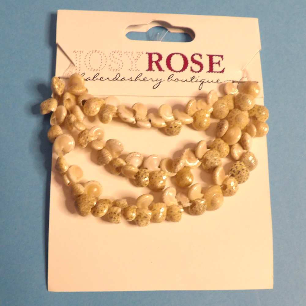 Card of small ivory shell beads Josy Rose Brand