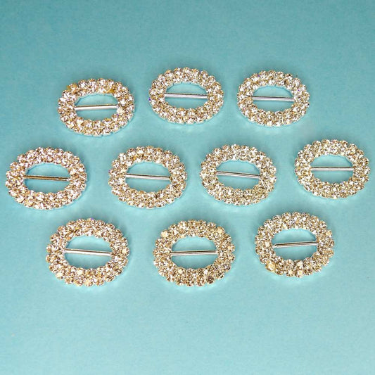 10 Oval Shaped Buckles two rows of Sparkly  Diamantes Set In Silver Colour Metal 15mm bar size 25mm x 20mm clearance