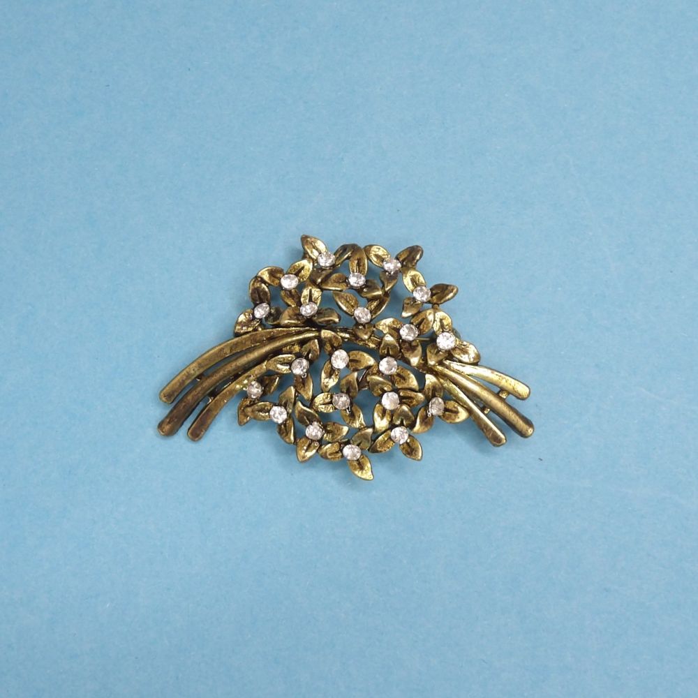 Gold colour metal brooch with diamante type stones size 55mm x 35mm clearance