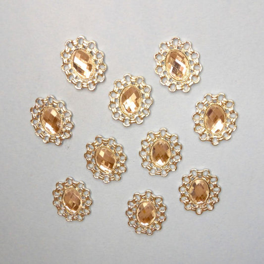 10 Oval silver colour metal flat back with clear stone in centre trims size 26mm x 22mm clearance