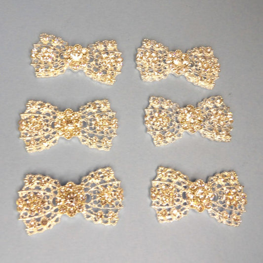 10 Light Silver colour metal Flat Back Trims  BOW SHAPE with Clear diamante size 46mm x 25mm clearance