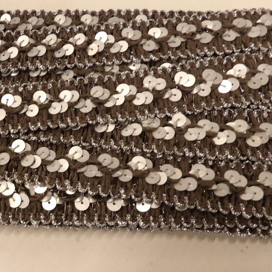 ! Only one card of 12 metres of dark grey and matt silver sequins braid 25mm wide