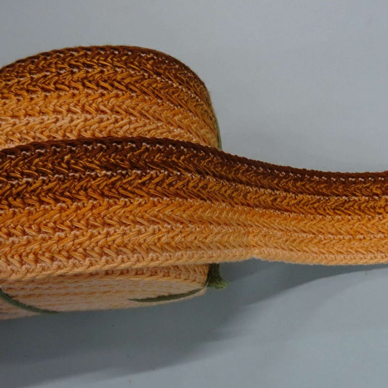 23 metres approximately of brown old gold shade colour braid type elastic 45mm wide clearance