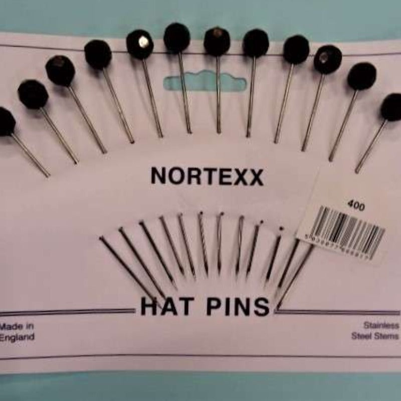 Card of 12 hat pins with black faceted top