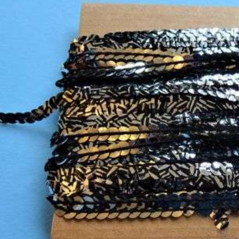 20 metre of 6mm silver/black sequins random pattern on a card clearance