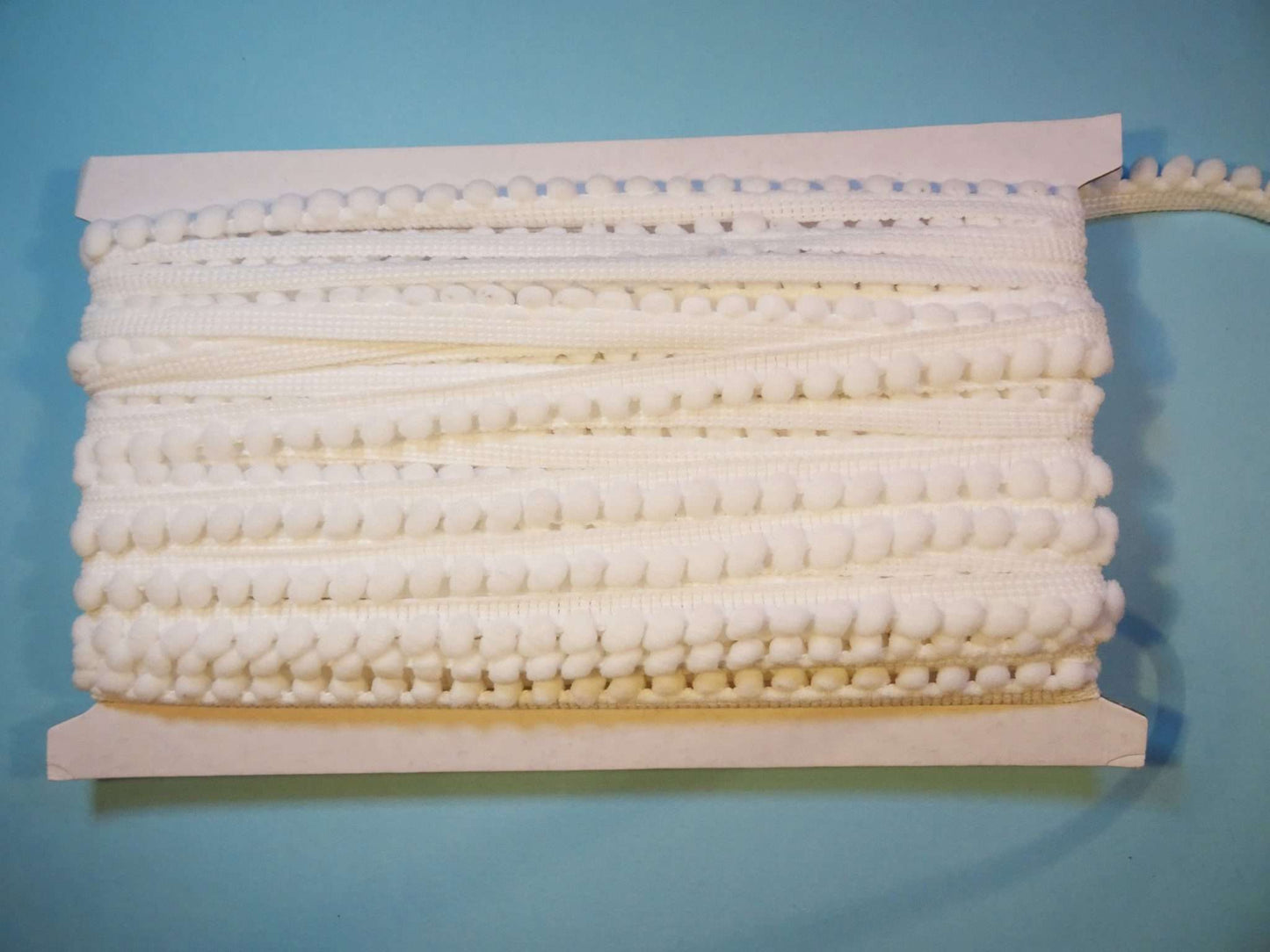 10 metres of braid with pom pom like edge 10mm wide