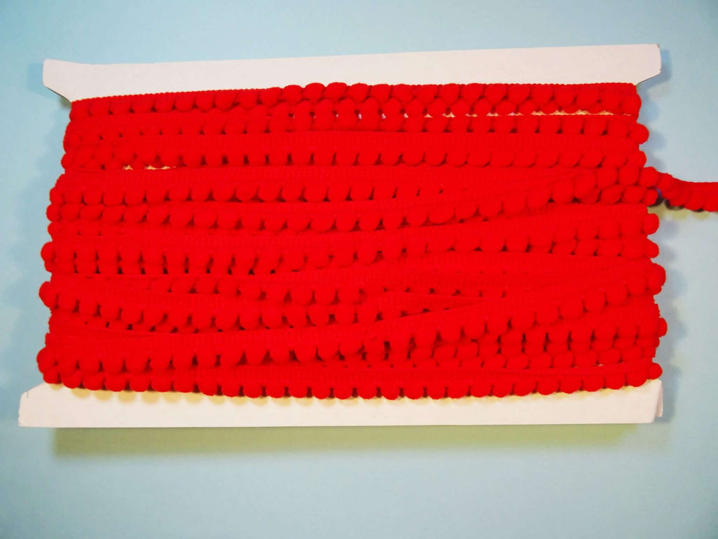 10 metres of braid with pom pom like edge 10mm wide