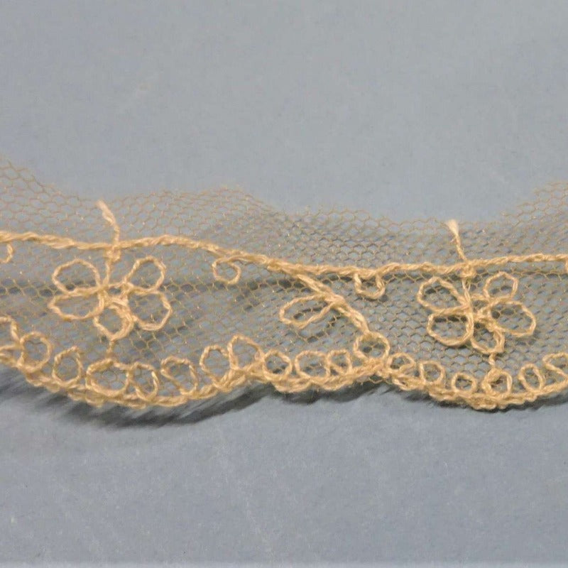 5 x 8.7metres of fawn net lace with ivory stitched design 25mm wide clearance