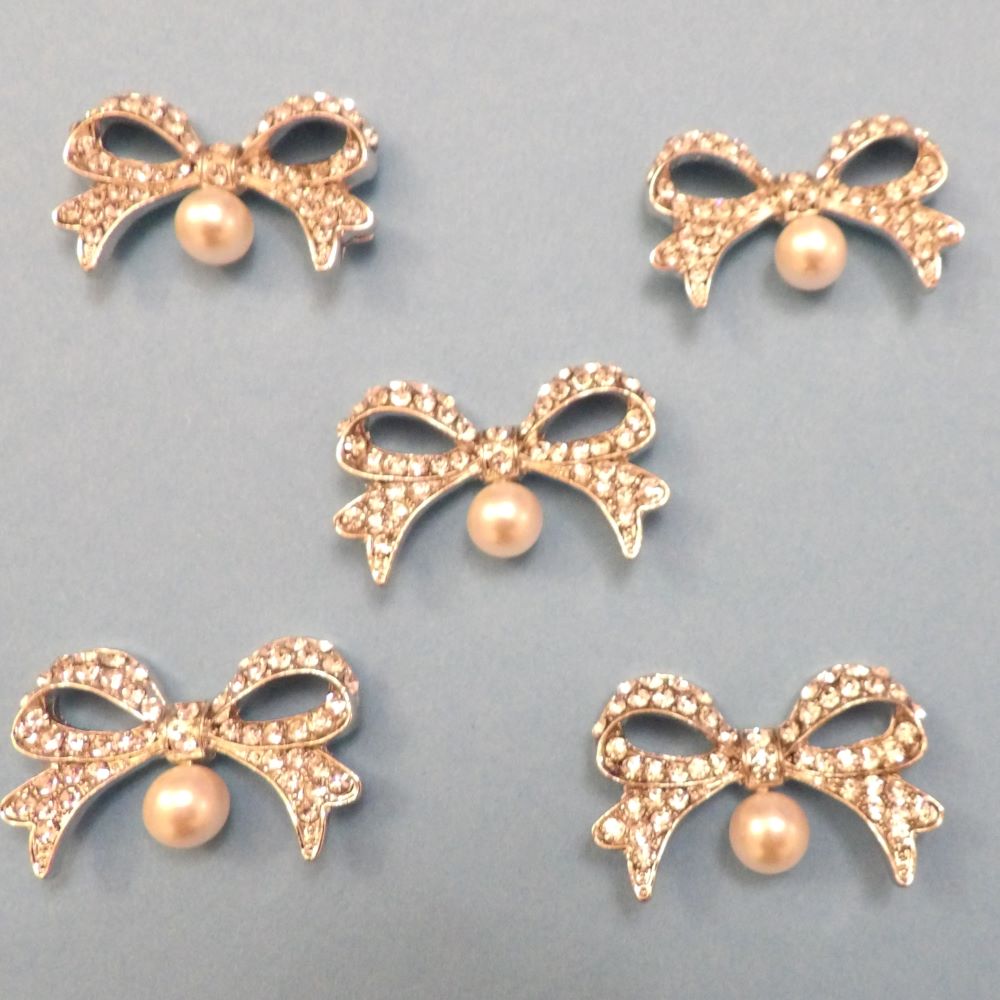 10 Diamante and one 9mm Pearl Bow Sparkly Metal Trims size 43mm x 28mm with Flat Back clearance