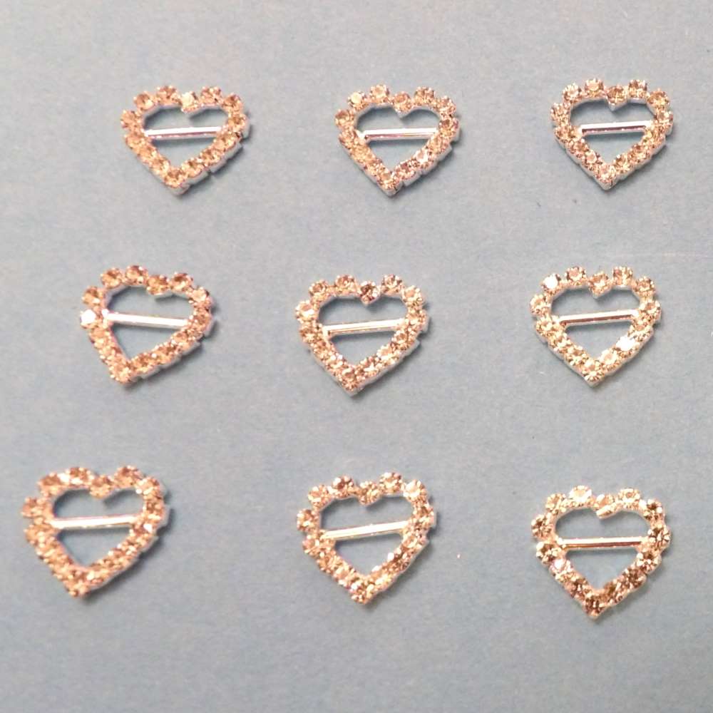 9 Small Heart Buckles with a 6mm bar Sparkly Diamantes Set In Silver Colour Metal size 12mm clearance