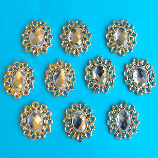 10 Oval light gold metal flat back with clear stone in centre trims size 26mm x 22mm clearance