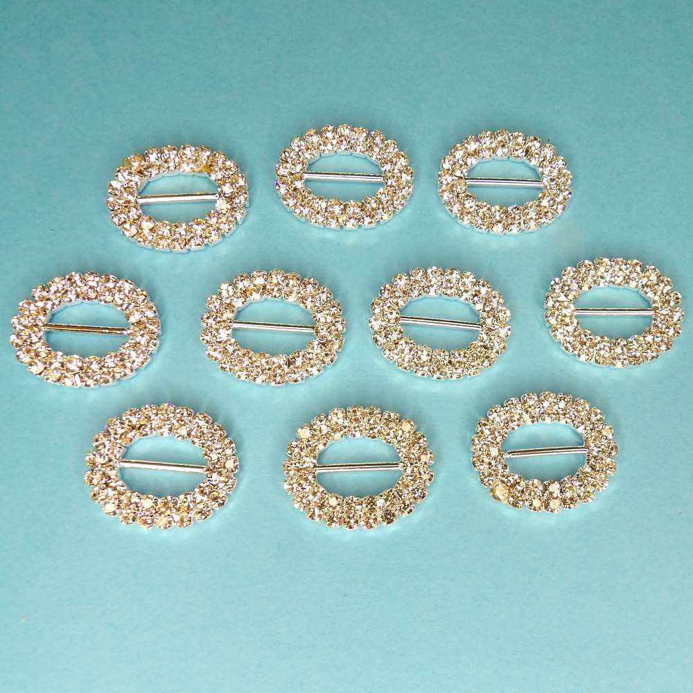 10 Oval Shaped Buckles two rows of Sparkly  Diamantes Set In Silver Colour Metal 15mm bar size 25mm x 20mm clearance
