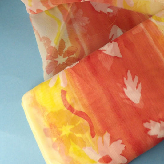 10 metres of Burnt Orange and Yellow floral Chiffon Type fabric 150cm wide clearance loose in a bag