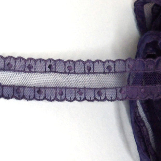 8.5 metres approximately of navy embroidered design lace with fine net centre 25mm wide clearance loose in a bag