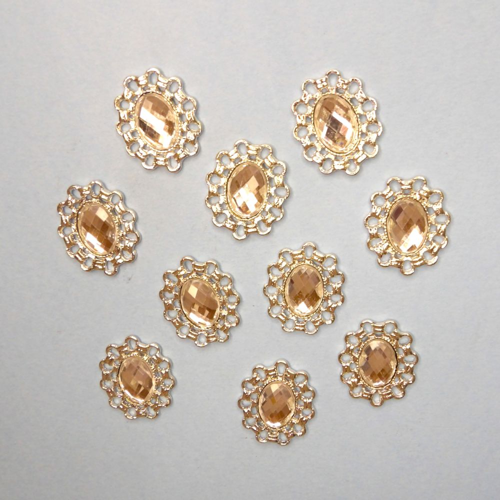 10 Oval silver colour metal flat back with clear stone in centre trims size 26mm x 22mm clearance
