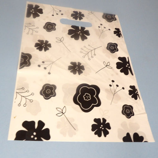 100 Small White With Black Floral Design Party Bags / Carrier Bags Size 23cm x 30cm / 9 x 12 Inch Clearance
