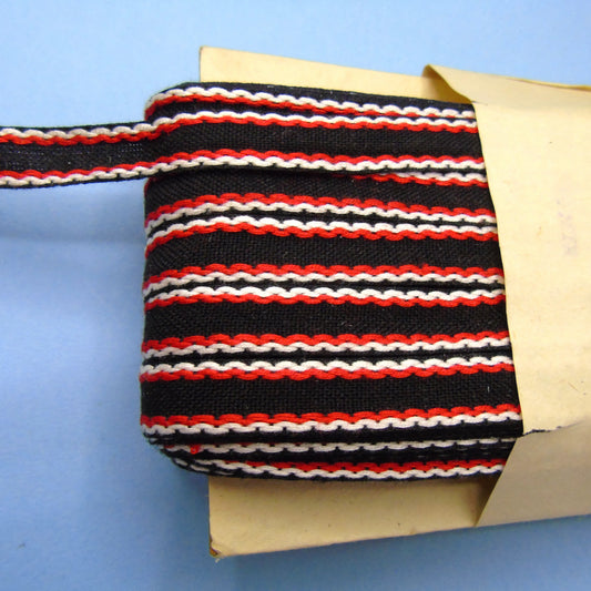50 Metre Card Of Black Tape Type Braid With Embroidered Red And White Stitched Edge Design 15mm Wide Clearance