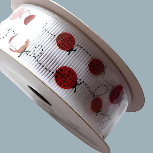 10 metres of white grosgrain ribbon with Red Lady Bird design size 22mm