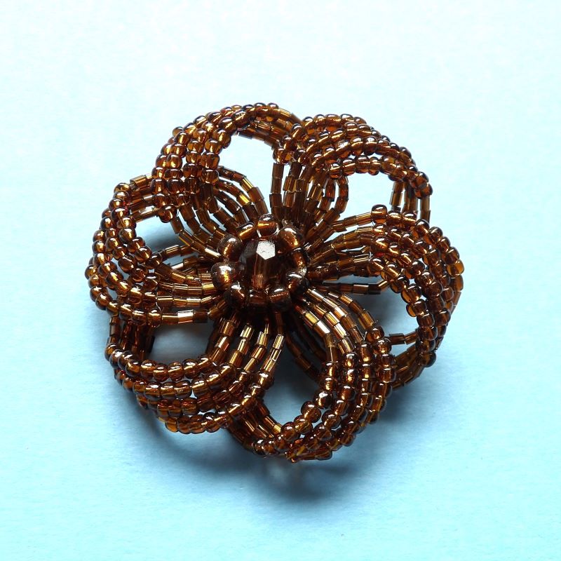 beaded brooch copper colour with stone in centre size 60mm clearance