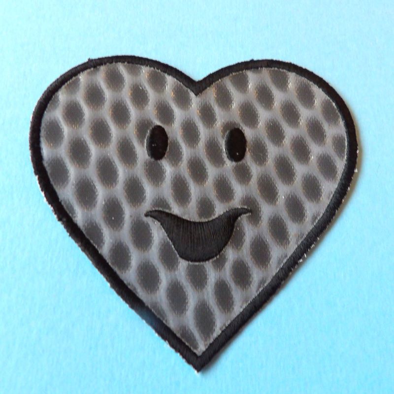 5 grey holographic embroidered heart motif with smiley face size 75mm clearance