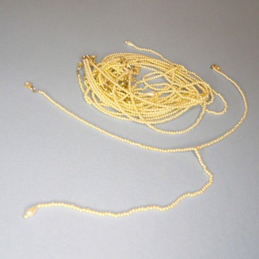 10 Trims 2.5mm Ivory Beads and 2 metal clasps 32cm long clearance
