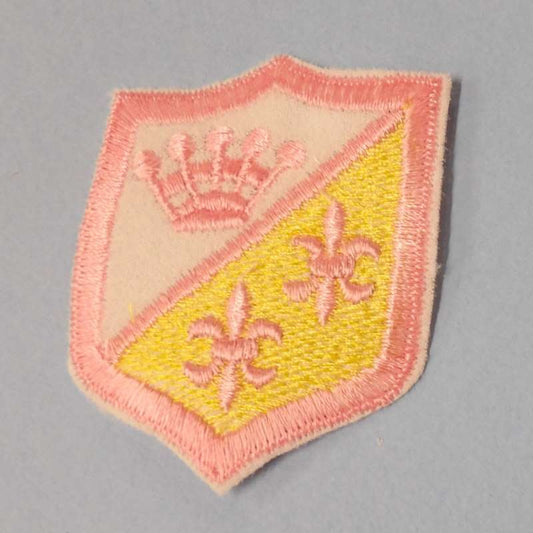 10 shield shape embroidered iron on motifs with white / light pink / yellow motifs size 65mm x 55mm clearance