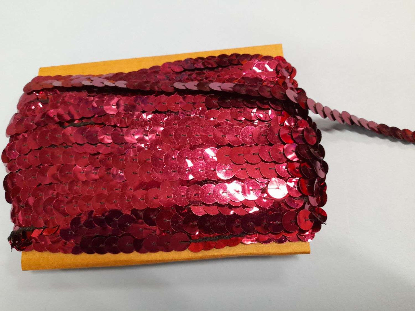 20 metre approximately of 10mm strung sequins maroon on a card clearance
