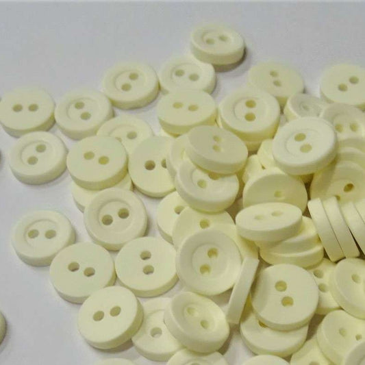 100 small ivory colour buttons with 2 holes size 10mm clearance