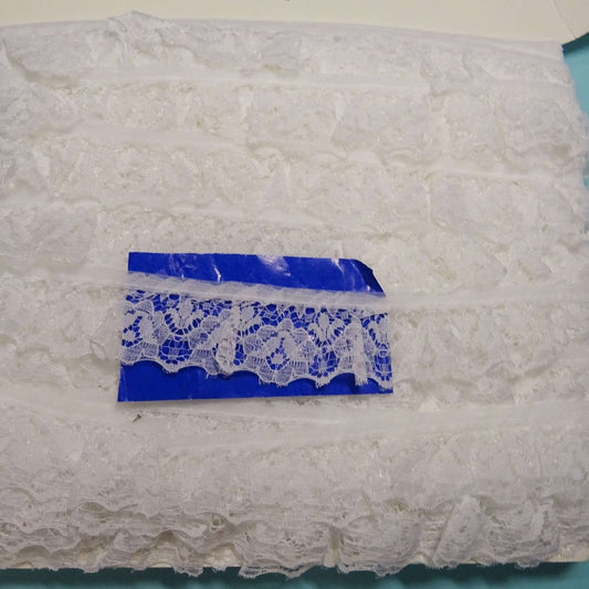 33 metres of white gathered lace 30mm designs may vary