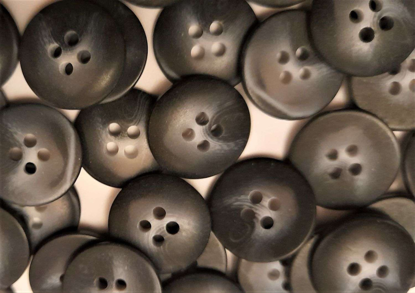 100 dark grey colour with lighter centre 4 hole buttons size 18mm clearance