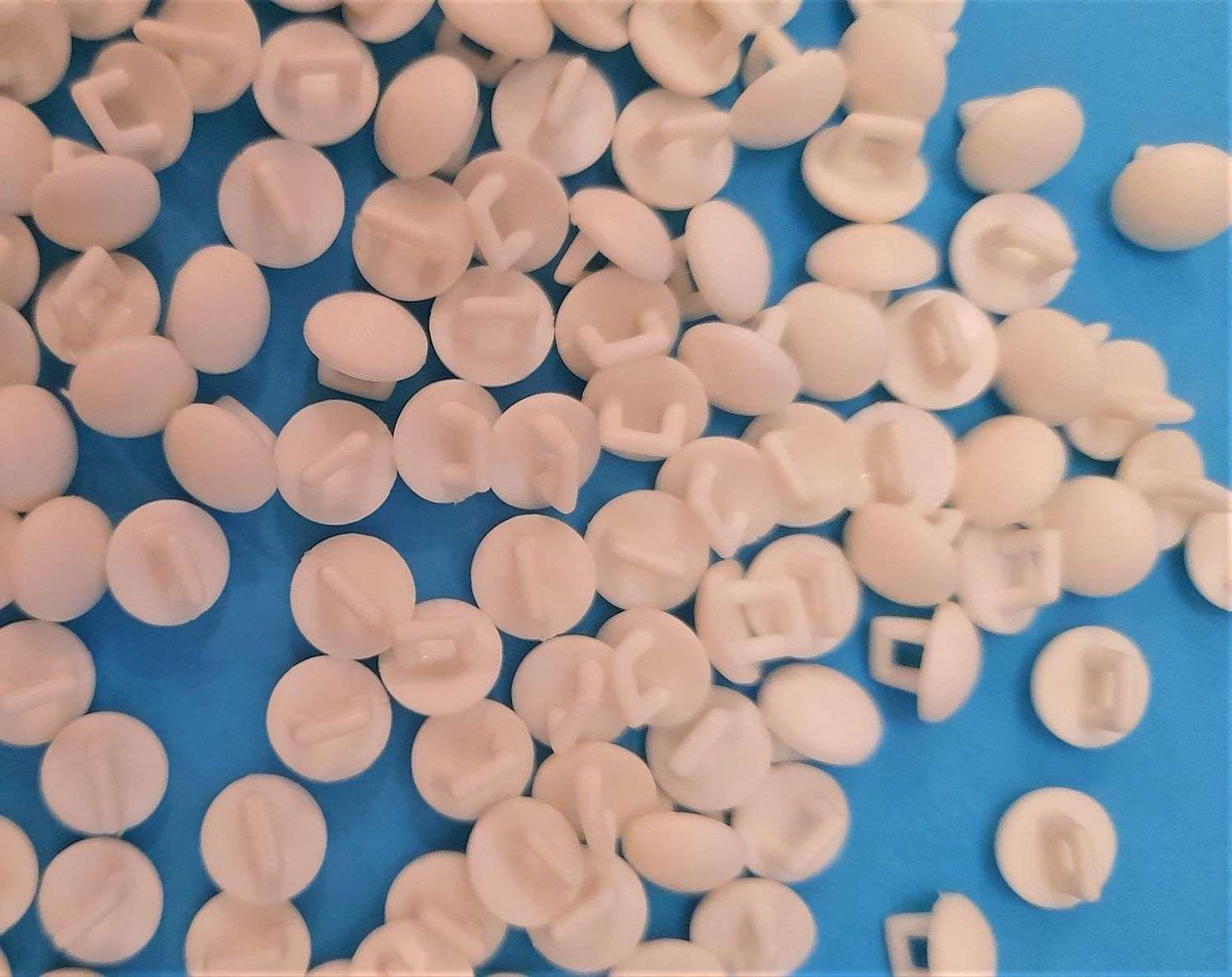200 small raw white shank buttons 10mm clearance