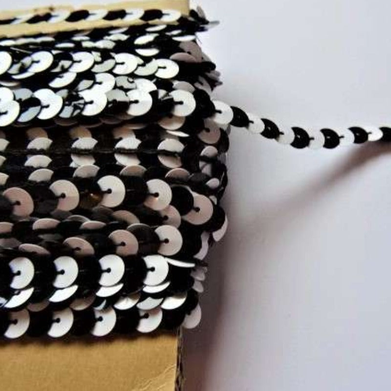 20 metre card of approximately of 8mm  strung sequins two tone Black / White clearance