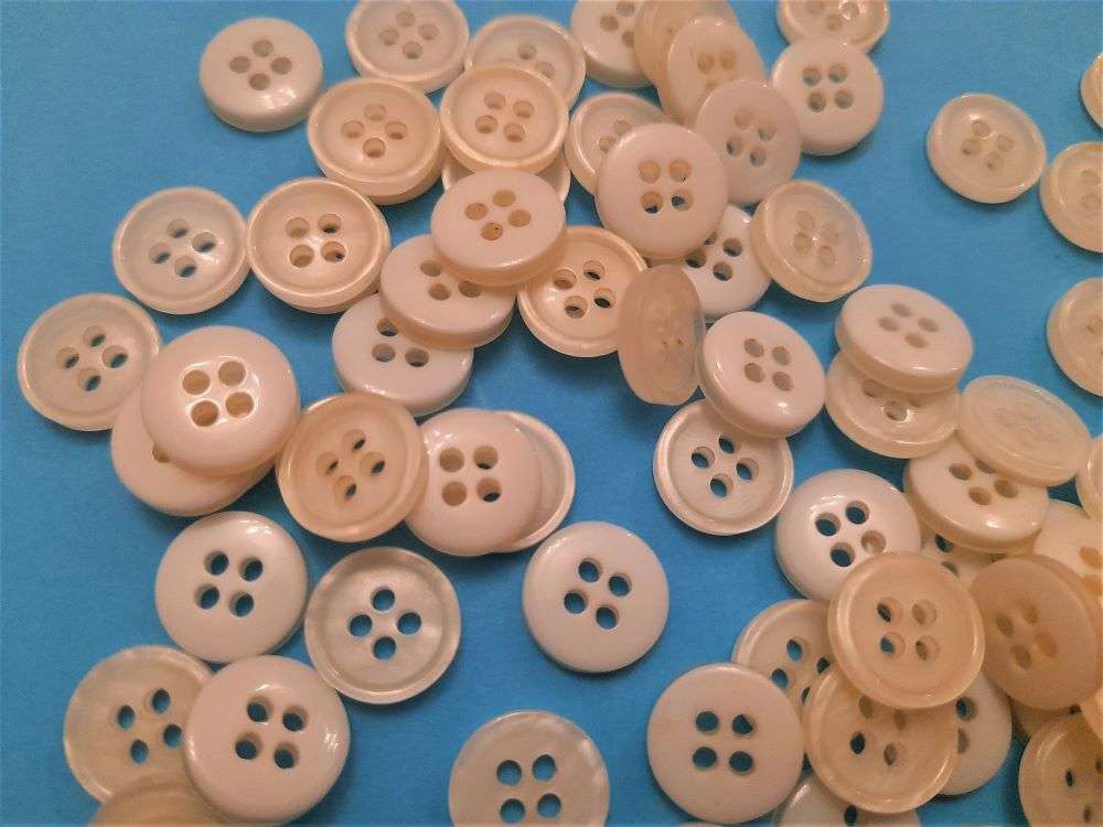 100 small ivory colour 4 hole buttons size 11mm clearance