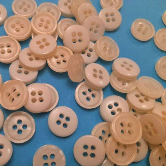 100 small ivory colour 4 hole buttons size 11mm clearance