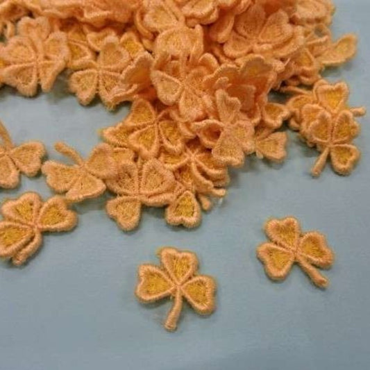 120 small clover leaf sew on motifs light orange edge 20mm clearance