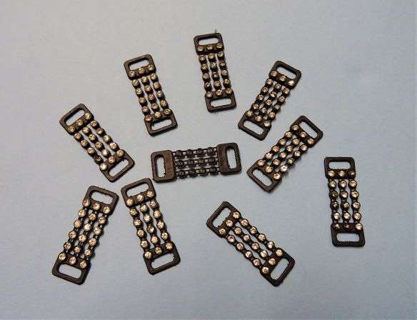 10 black plastic strips with 3 rows of 6 clear 3mm diamantes with loop at each end 40mm x 15mm