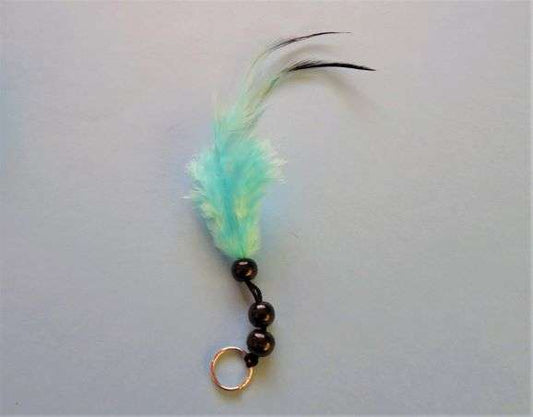 5 trims with  a small silver ring with 3 black 8mm beads and a turquoise feather 14cm long clearance
